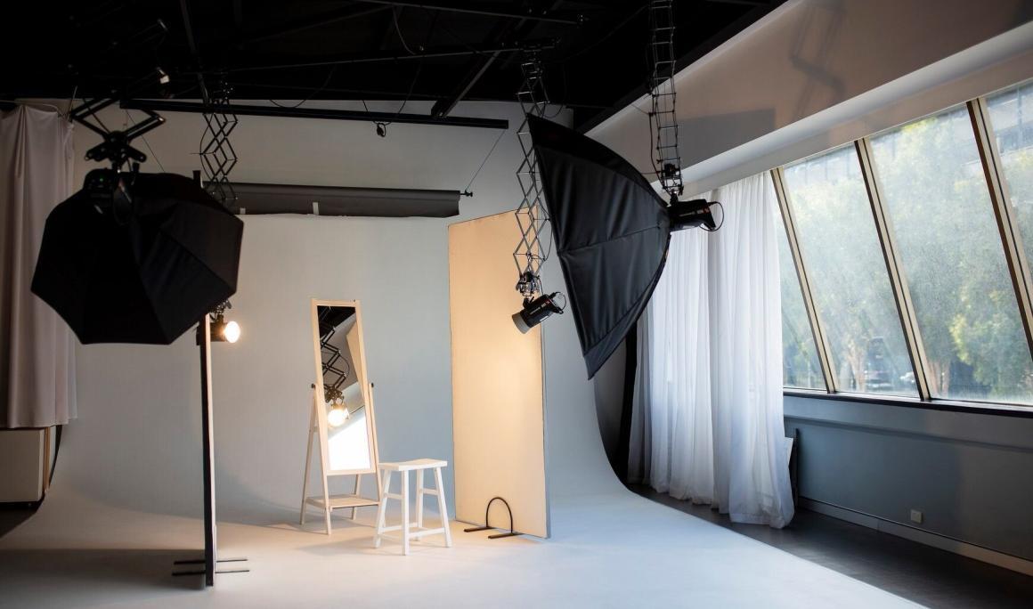 A wide shot of the inside of Studio Northbridge, with professional lights and props. One of Perth's best content studios