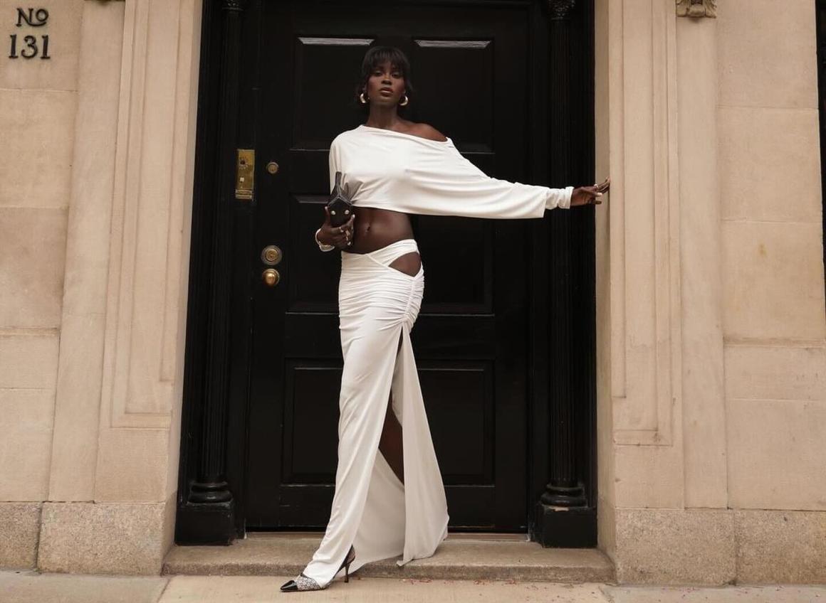 A model wearing one of Natalie Rolt's two piece white sets. One of Perth's best womenswear brands