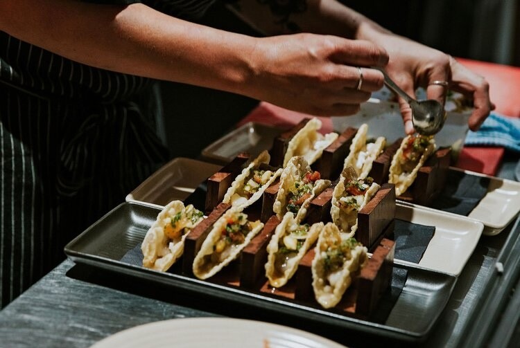 A chef making tacos in the kitchen at Blue Manna, a restaurant in Dunsborough