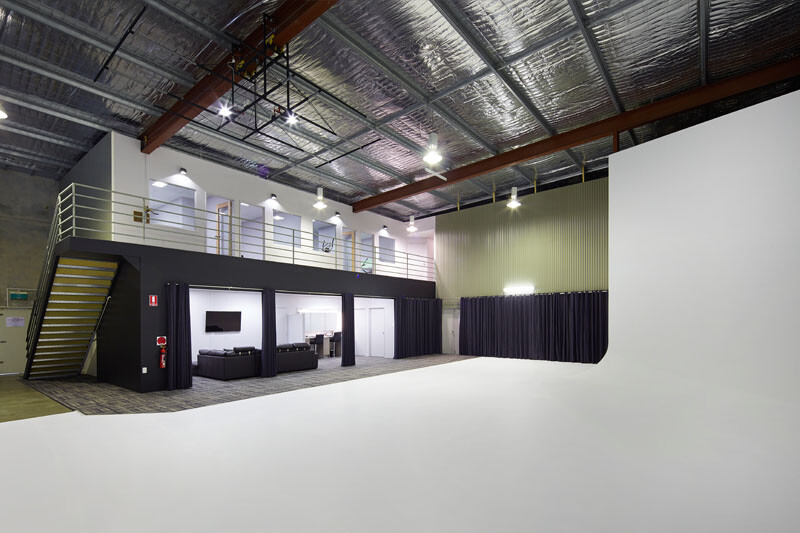A wide shot of the inside of Photofinity Studios, with professional lights and props. One of Perth's best content studios for social media content.