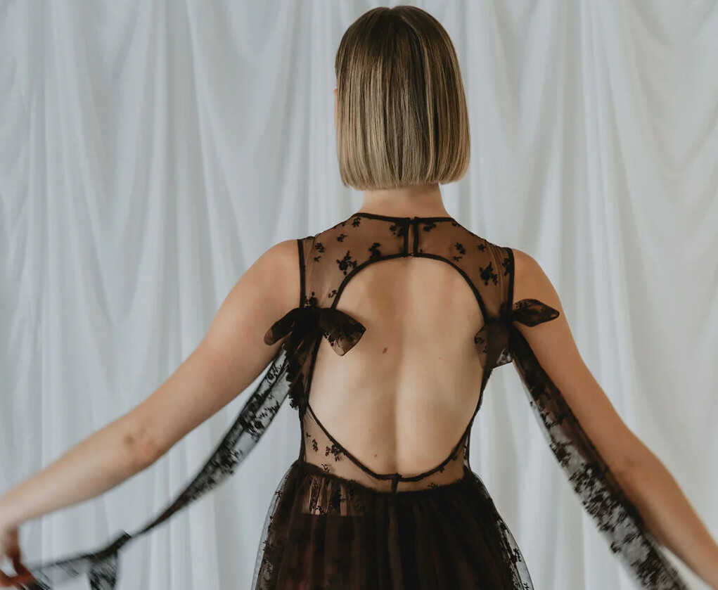 A model wearing one of Teagan Jacobs black dresses photographed from behind. One of Perth's best womenswear brands