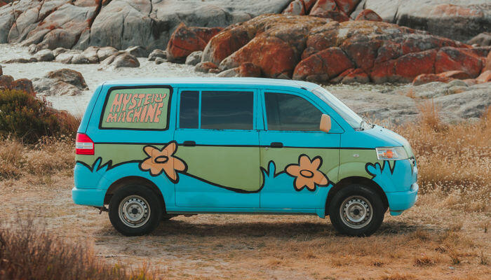 A photo of the exterior of the Mystery Machine campervan by Wicked campers. This is one of the best campervans to hire in Western Australia (WA).