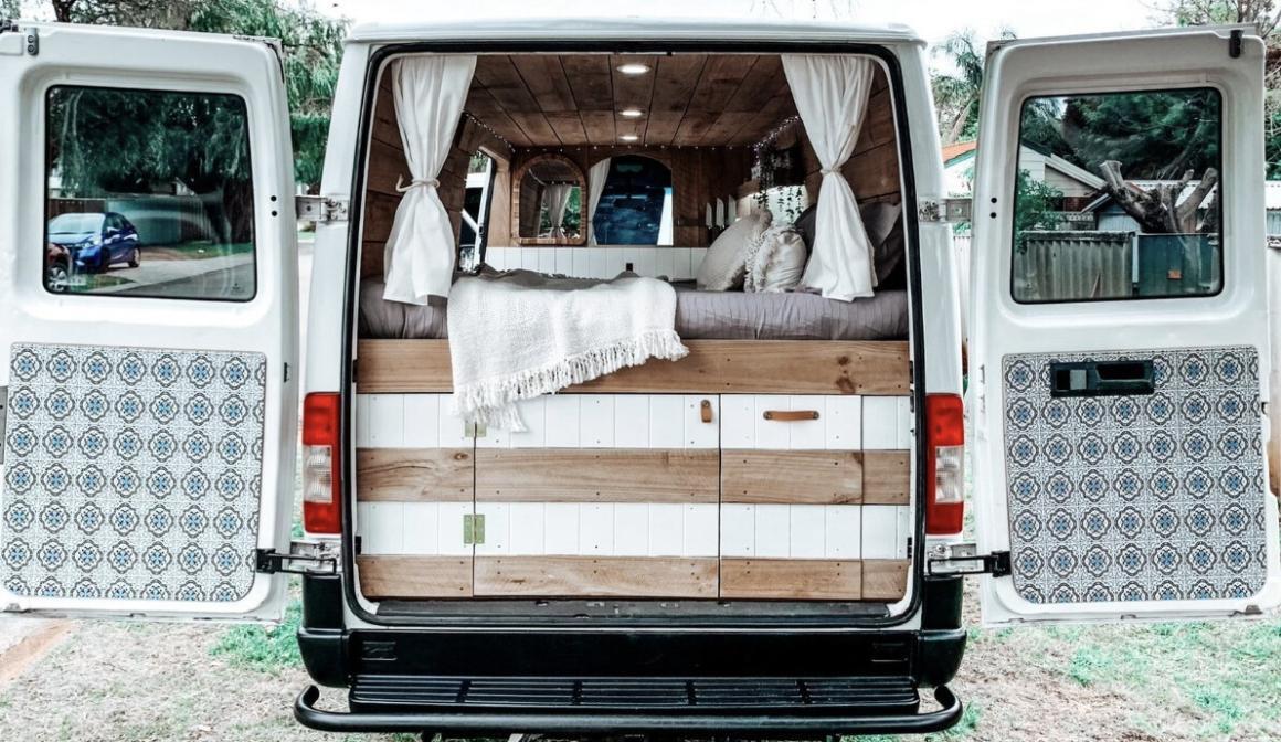 The back of the FRANKIE campervan wide open showing storage and the wallpaper. One of the most instaworthy campervans in WA