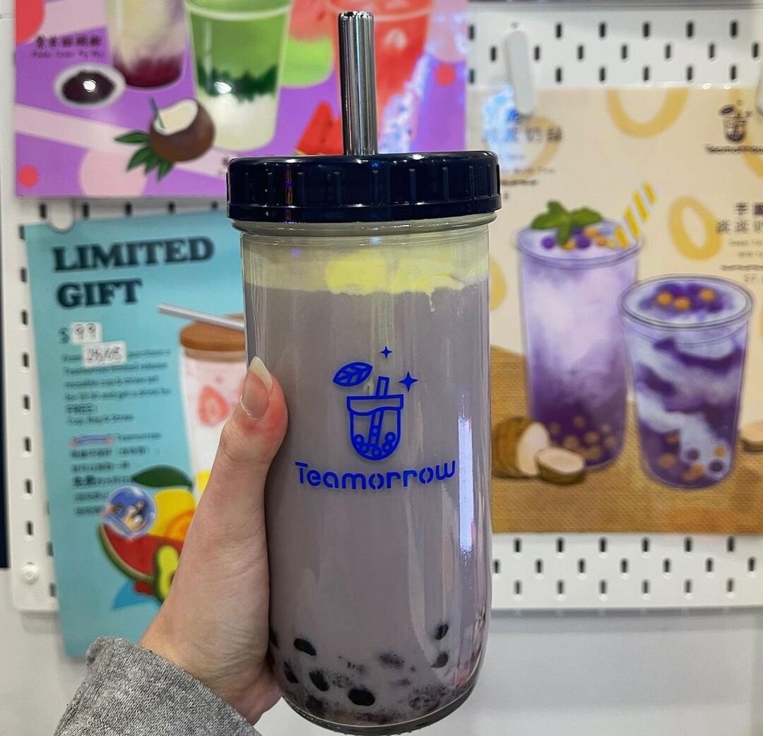 A woman holds a taro tea in a reusable cup at Teamorrow, one of Perth's best bubble tea spots