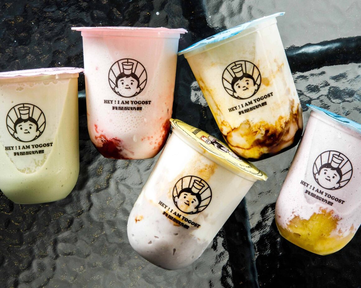 Five Hi! I Am Yogost bubble tea drinks lay on a glass table in Perth