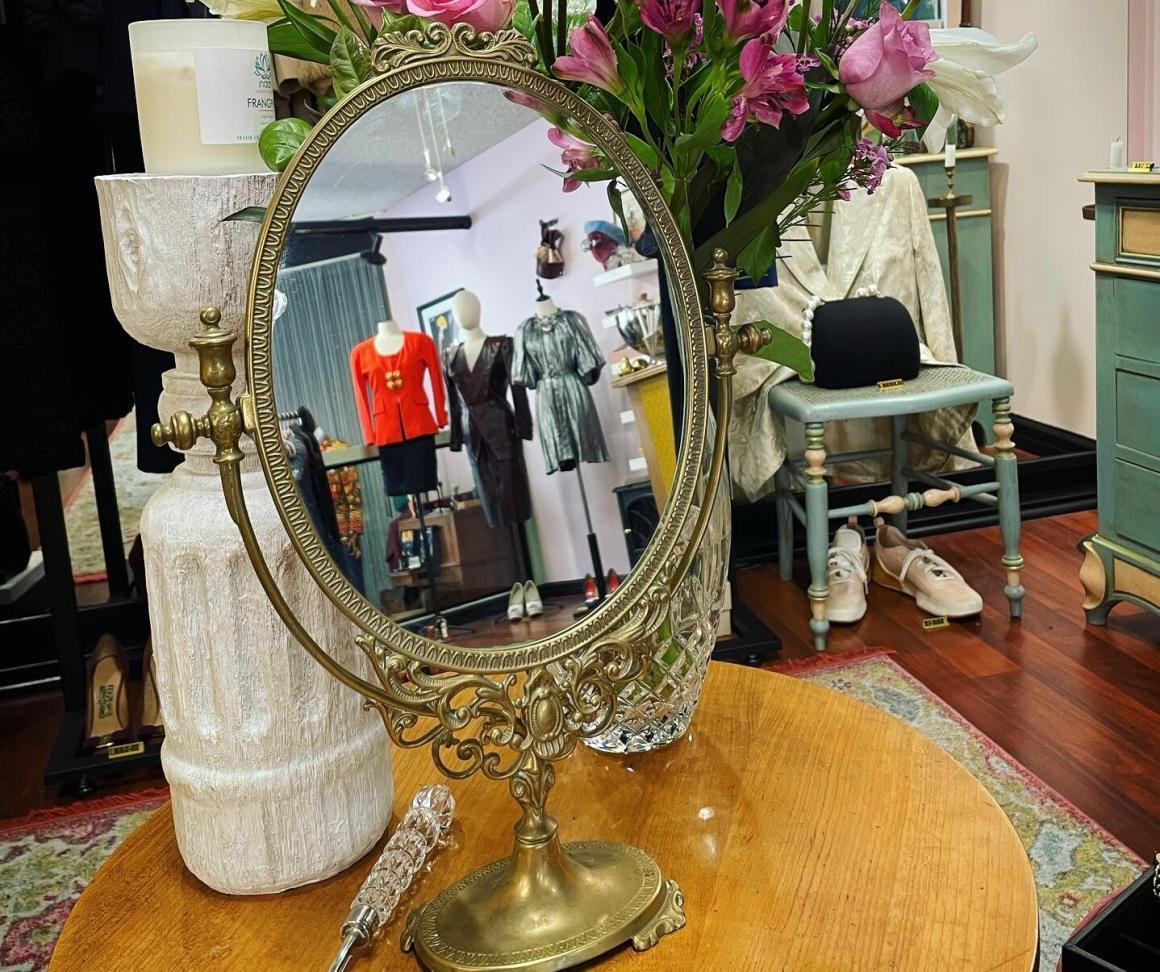 A mirror reflecting garments at FA Concept Vintage. One of the best vintage clothing stores in Perth