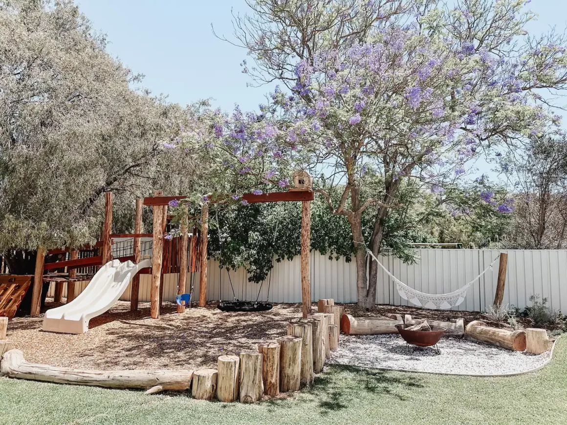 The playground and lawn in the backyard at Flo Stays. One of the best accomodations in Busselton to stay at