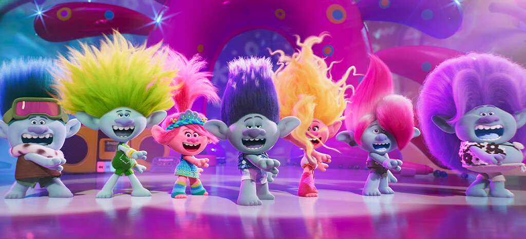 A still from Trolls Band Together, showing the main characters singing together on stage