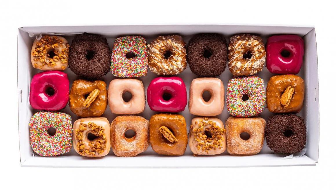 A platter of Top Dup Donuts with 21 donuts