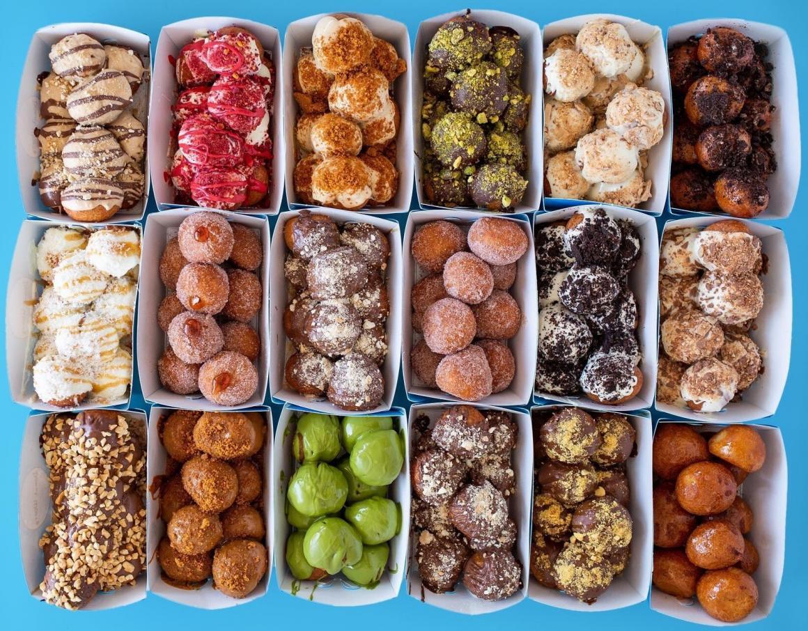 A top down view of all of Donut Worry's donut flavours in their containers