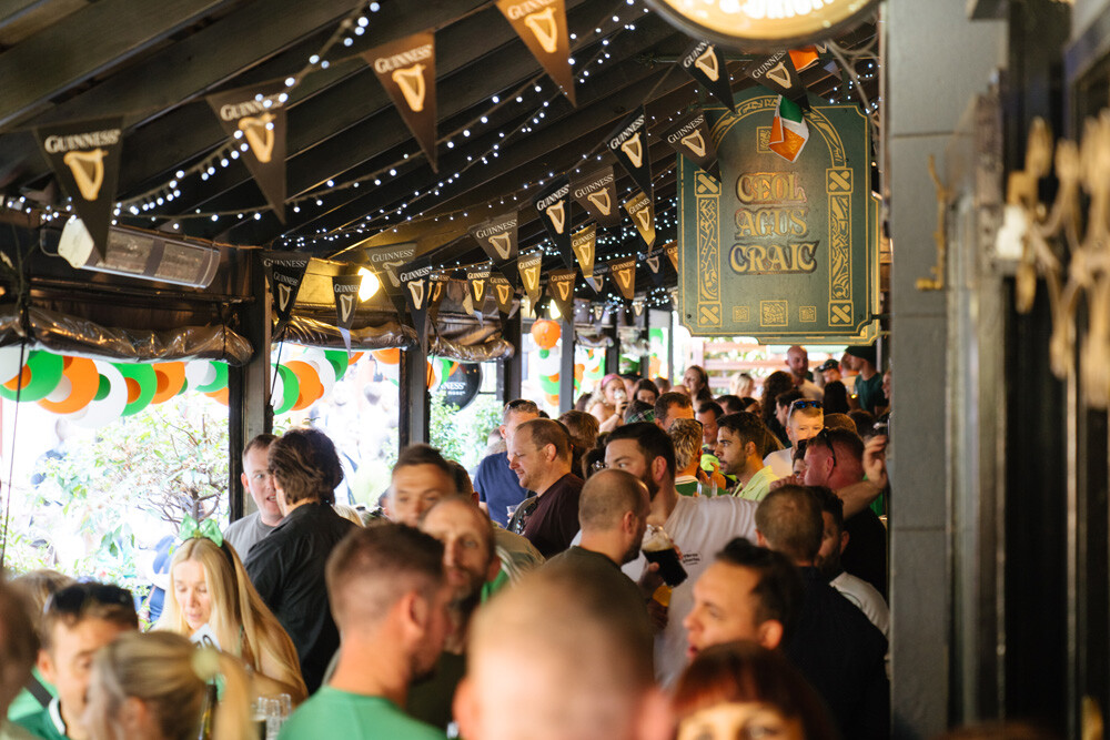 A large crowd outside of Durty Nelly's during St Patricks Day