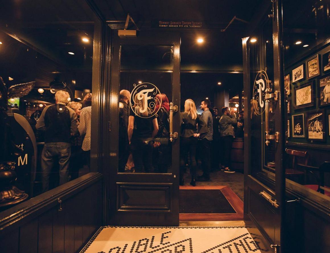 The doors of Fenway showing a crowded bar inside