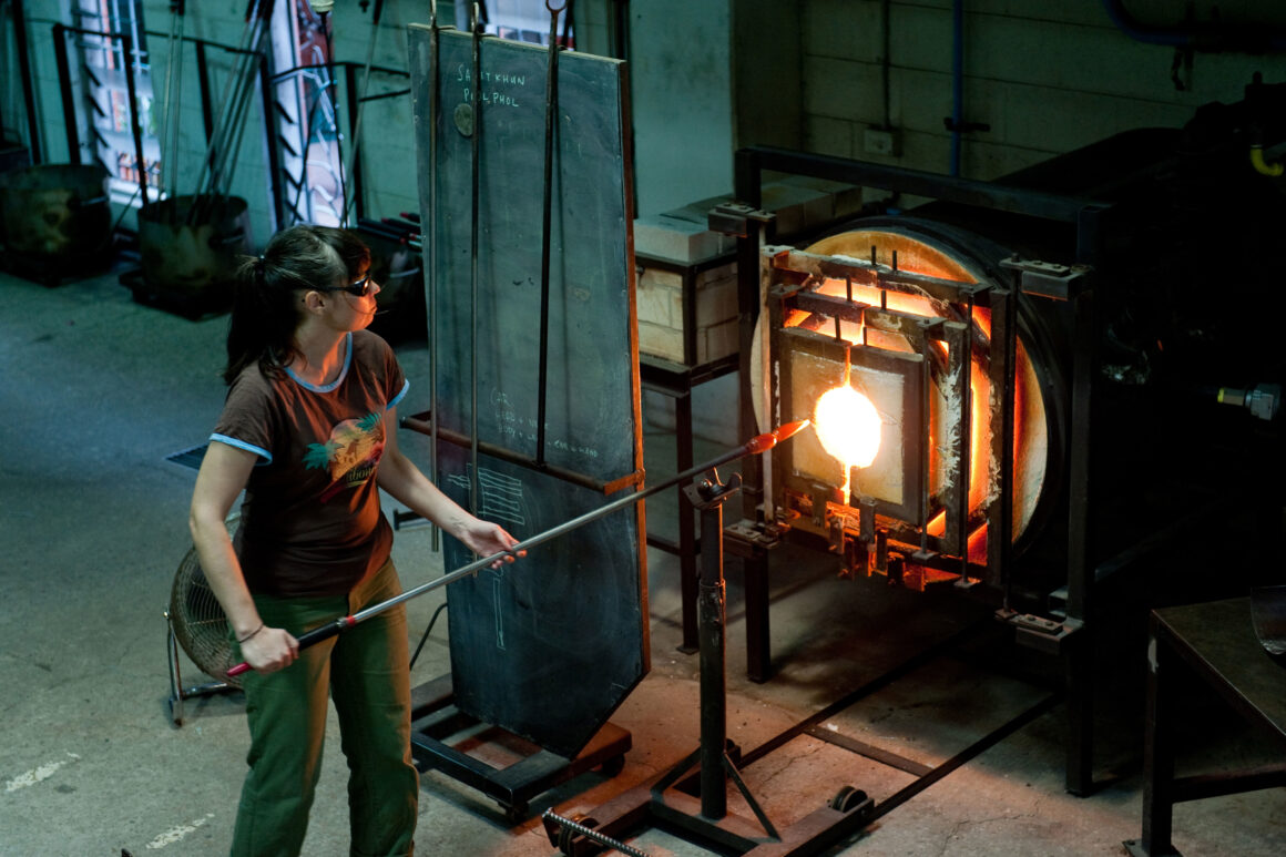 Yhonnie Scarce heating glass in a furnace