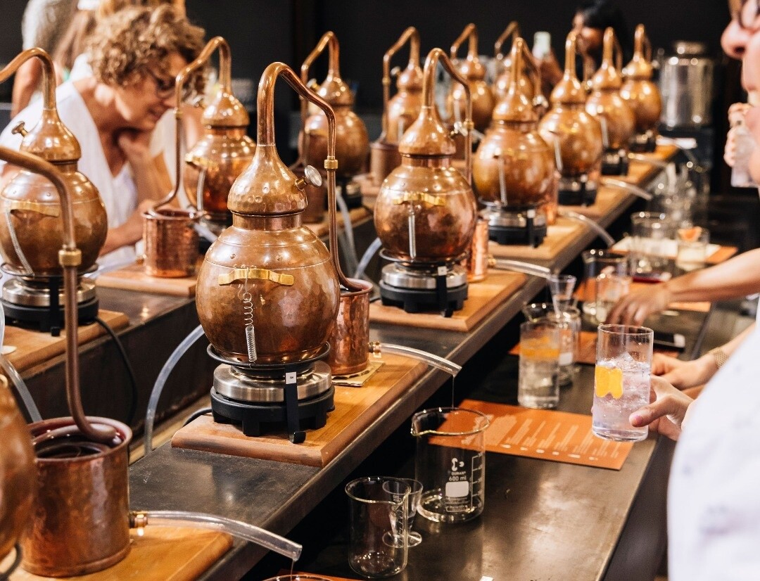 People sitting down to make their own gin