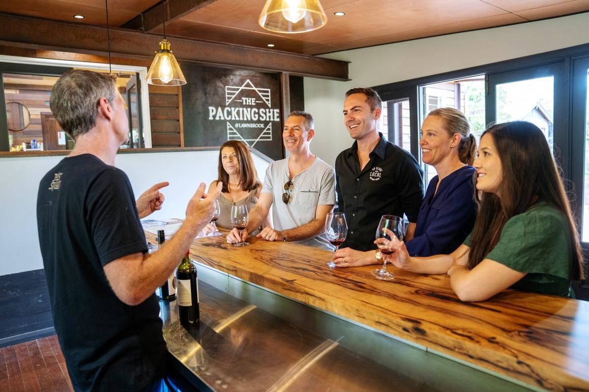 A group of people enjoying a wine tasting