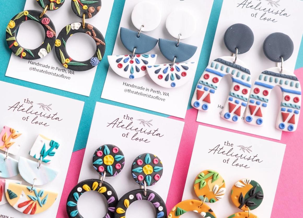 A flat lay of colourful polymer clay earrings