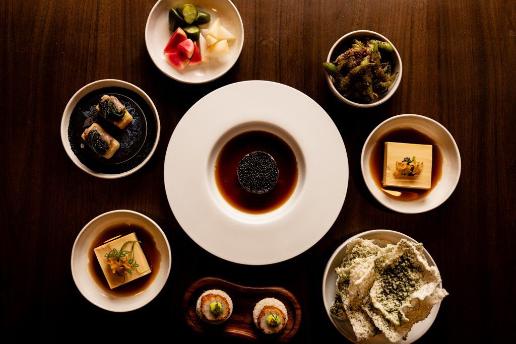 A top down image of several dishes from Papi Katsu on a table