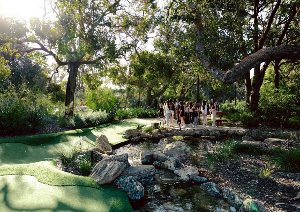 A wide shot of the Point Walter mini golf course amongst natural trees and a small waterway