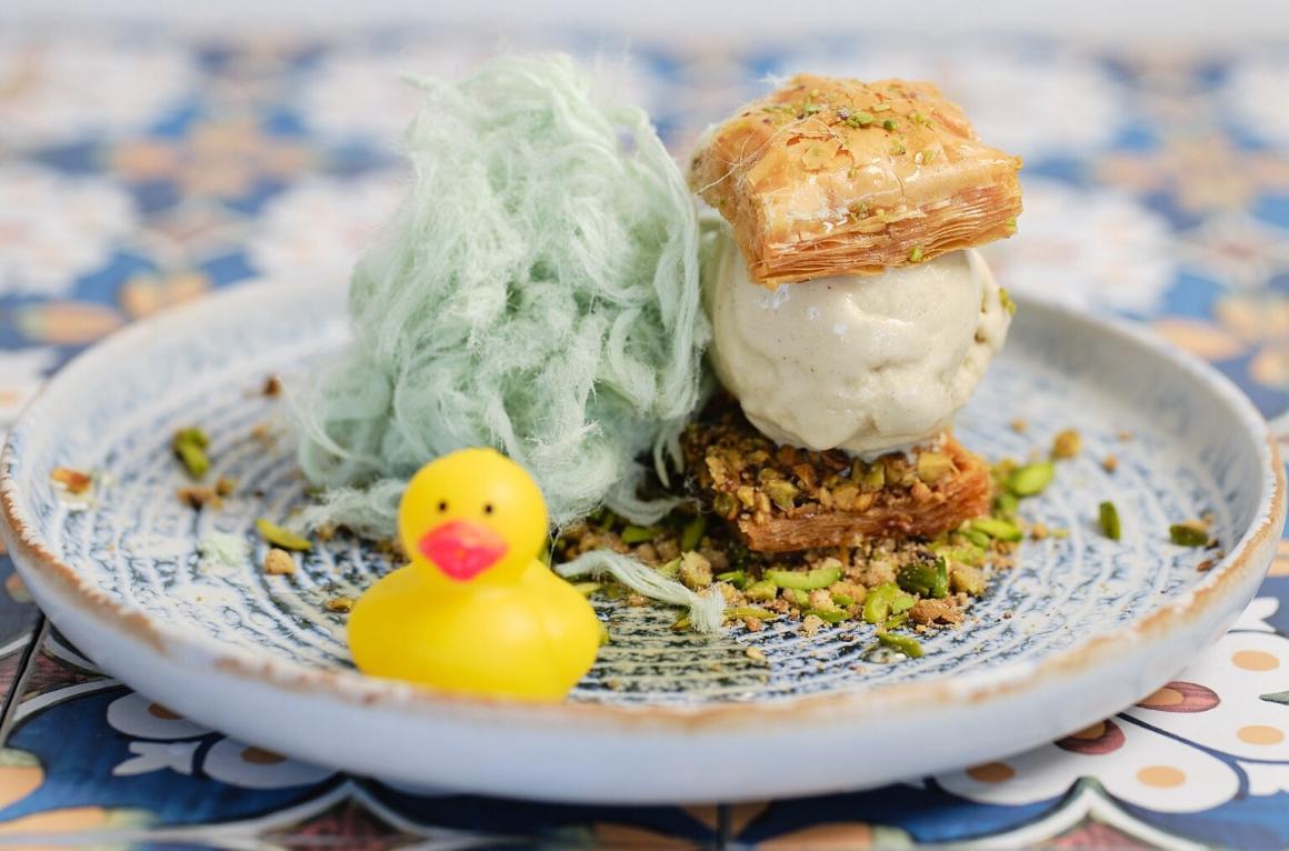 A fun meal on a plate with mint cotton candy and a rubber duck from Ugly Baby