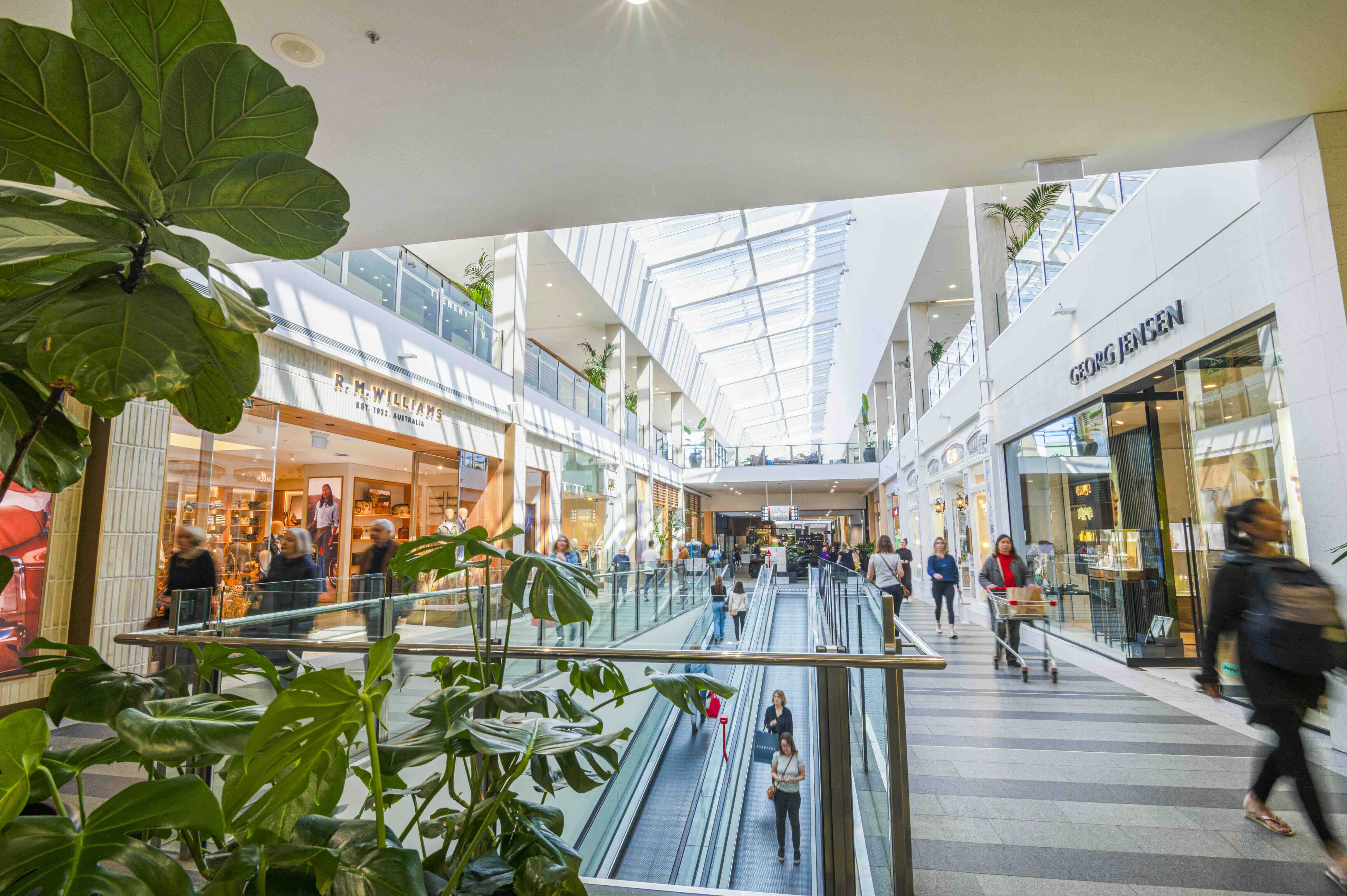 A wide shot of Claremont Quarter shopping centre. Spend & Win in the Claremont Town Centre graphic