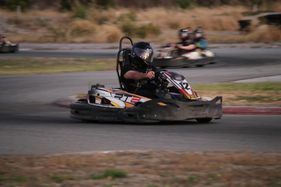 A close up on a man driving a go kart at Mega Fast Karts go karting in Perth