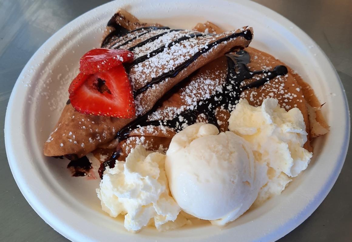 A crepe with ice cream, chocolate sauce and strawberries. From the winter wonderland at elizabeth quay, cosy @ the quay