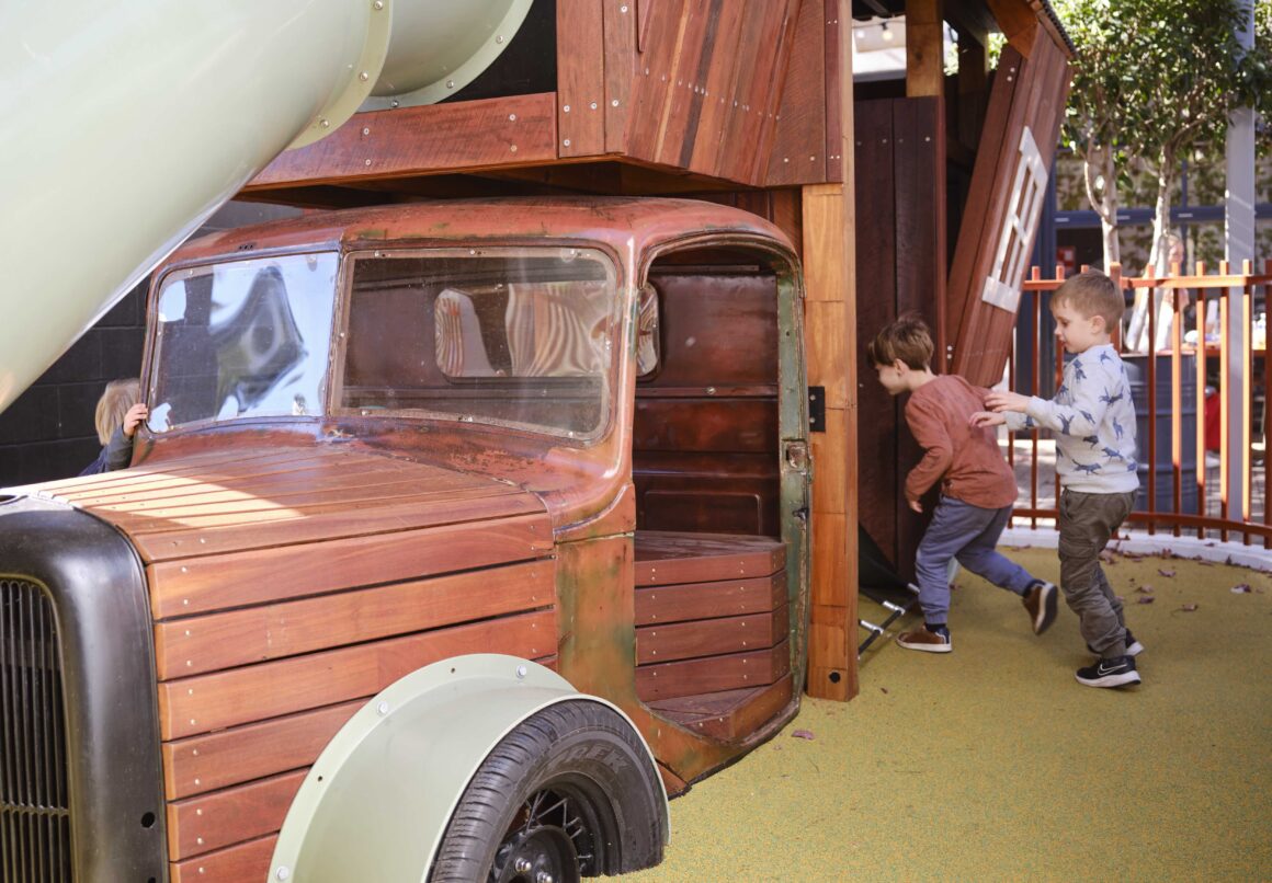 A close up of children playing on a truck playground at Vaudeville Hall at Perth's Guildford Hotel