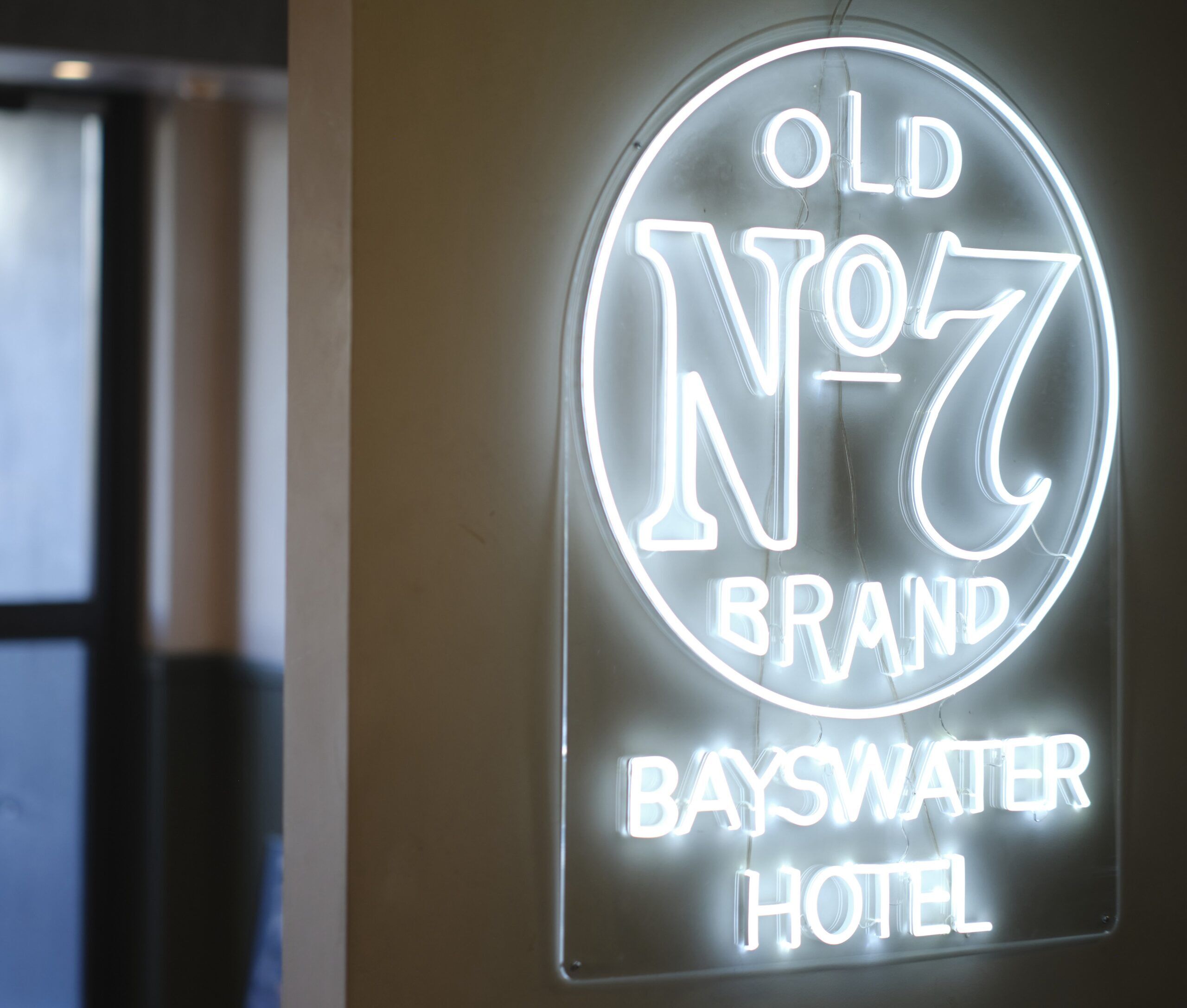 The indoor area of the Bayswater Hotel showing a neon sign added during their new renovation