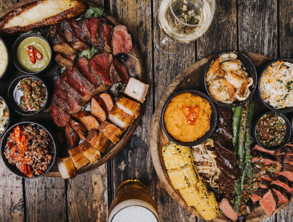 Two platters of food on a table at Angel Falls Grill, one of Perth's best steakhouses 