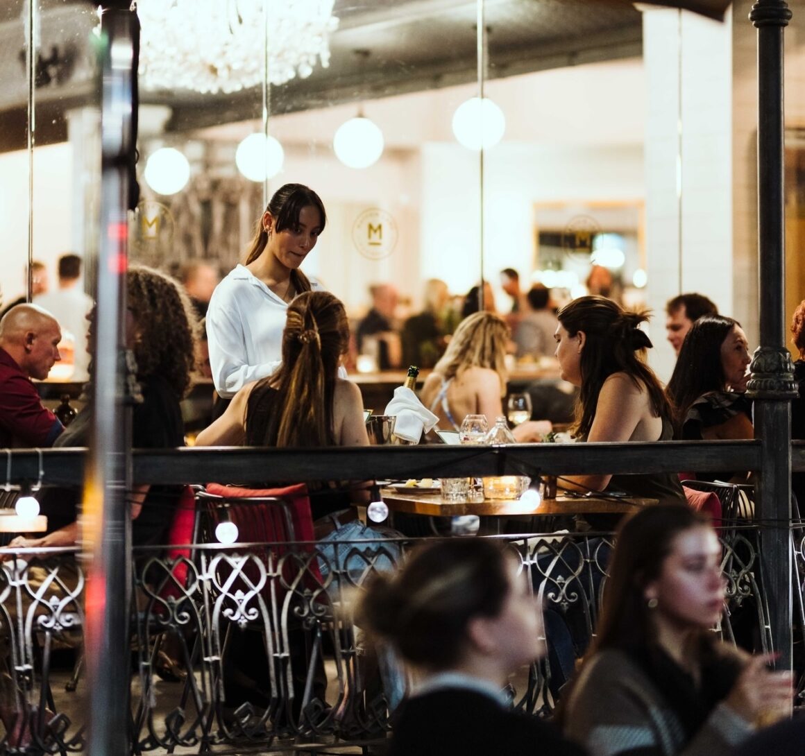 People enjoying dinner at Mayfair Lane, one of Perth's best steakhouses 