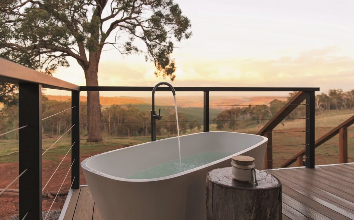 Serenity Gully glamping down south showing a bath on their deck with a great view
