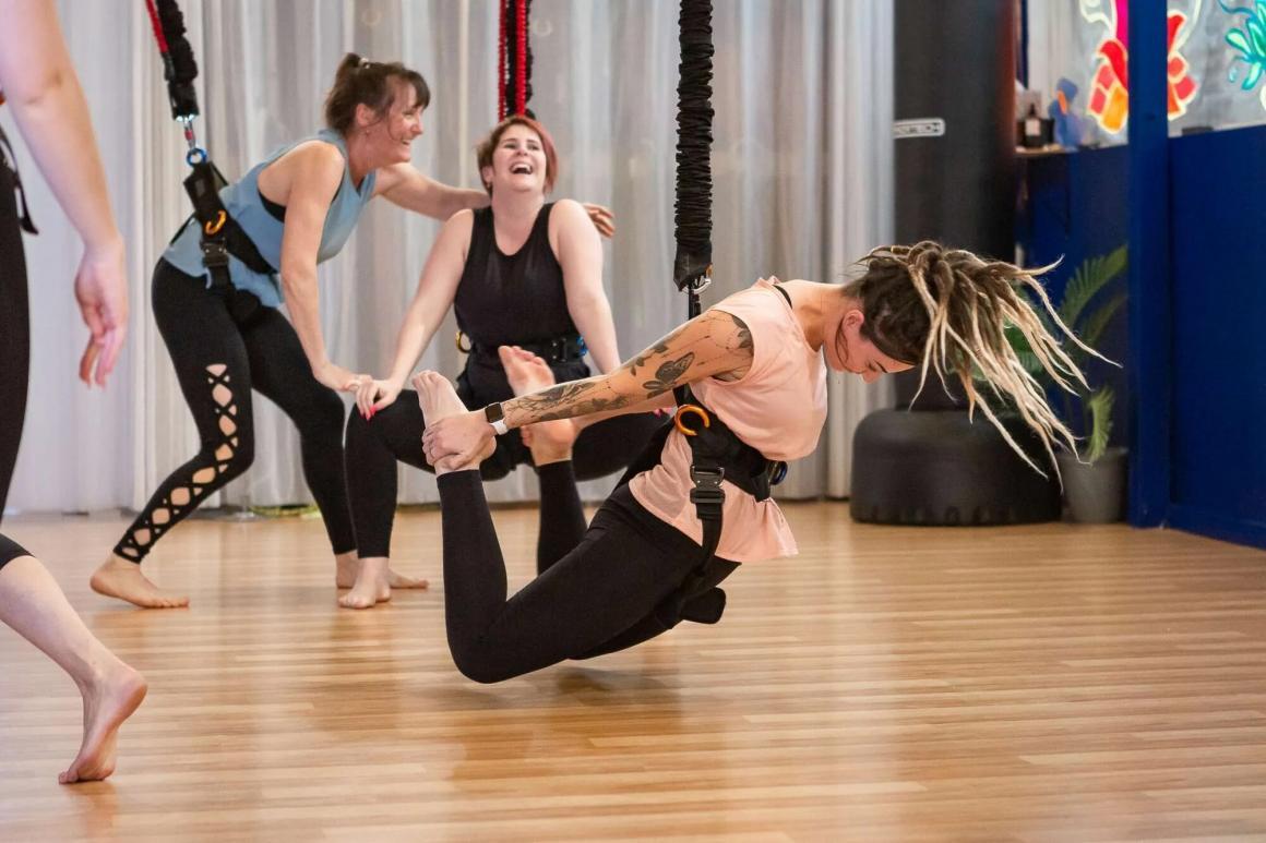 A group of women in bungee harnesses, one of the fun exercise classes to try in Perth