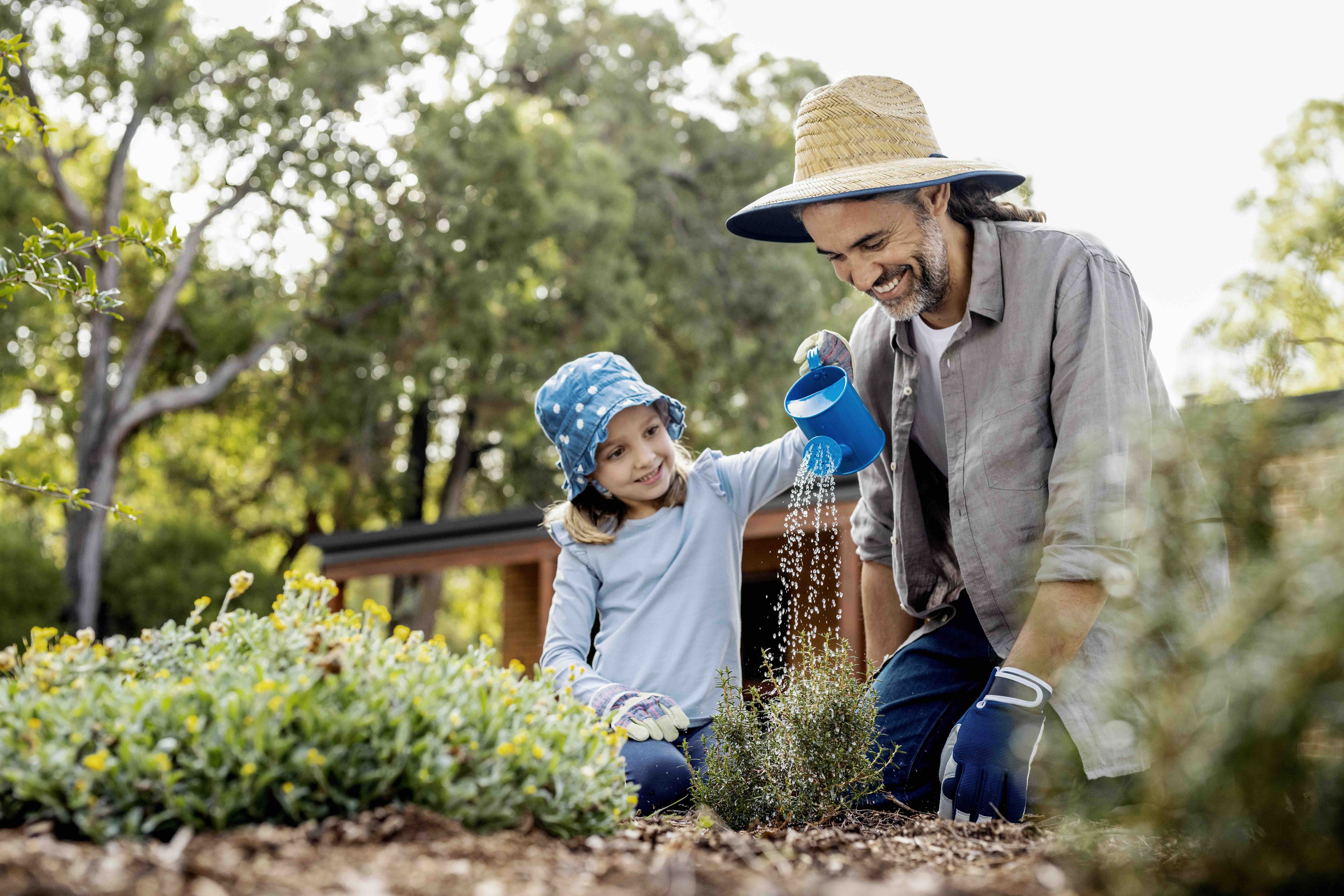 A father and a daughter gardening as part of the Winter Sprinkler Switch-off by Water Corporation