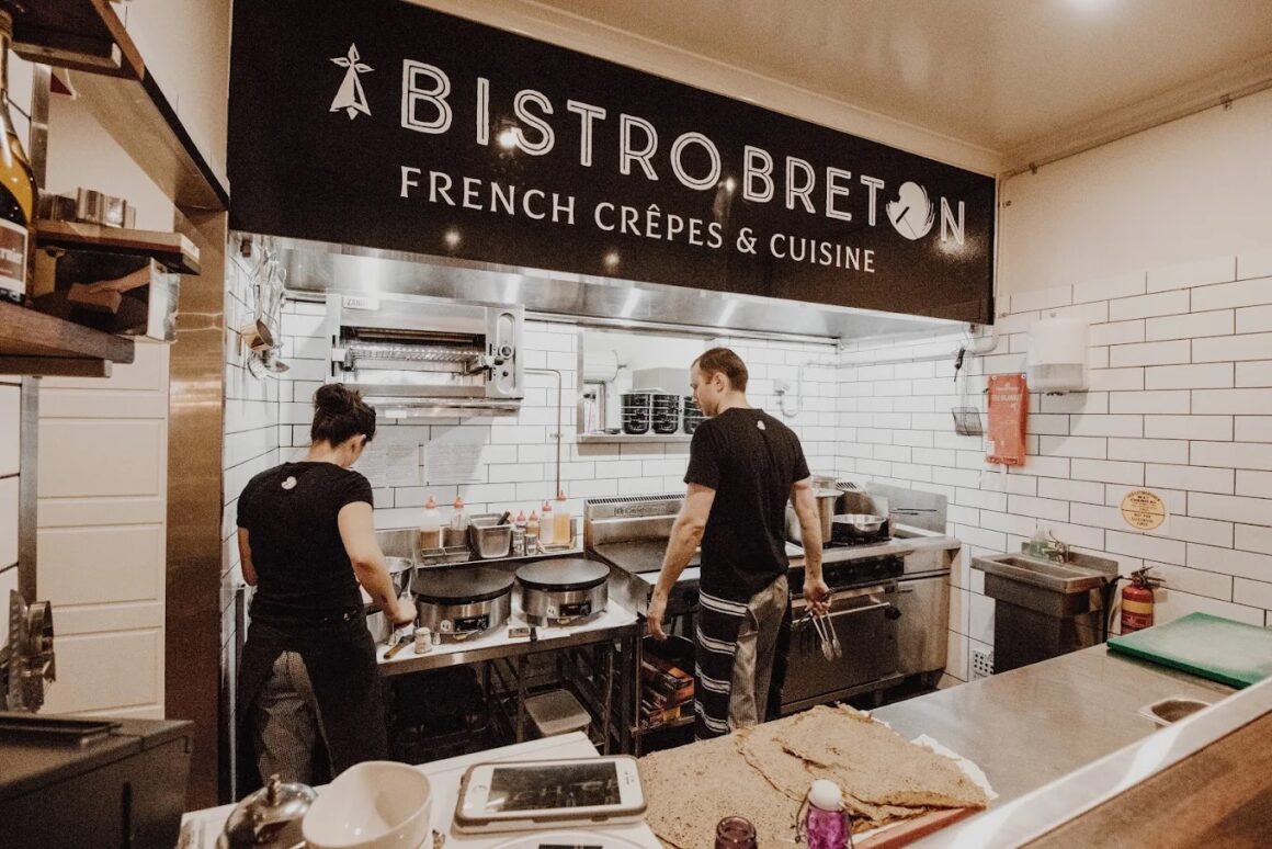The kitchen at Bistro Breton, A spread of food on the table at INARA, one of the best food spots in Busselton