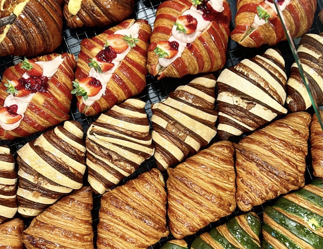 A selection of Croissants from Claudio Bakehouse, A spread of food on the table at INARA, one of the best food spots in Busselton