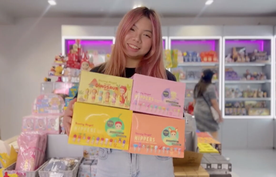 A girl holding Sonny Angels and Labubu's in Perth