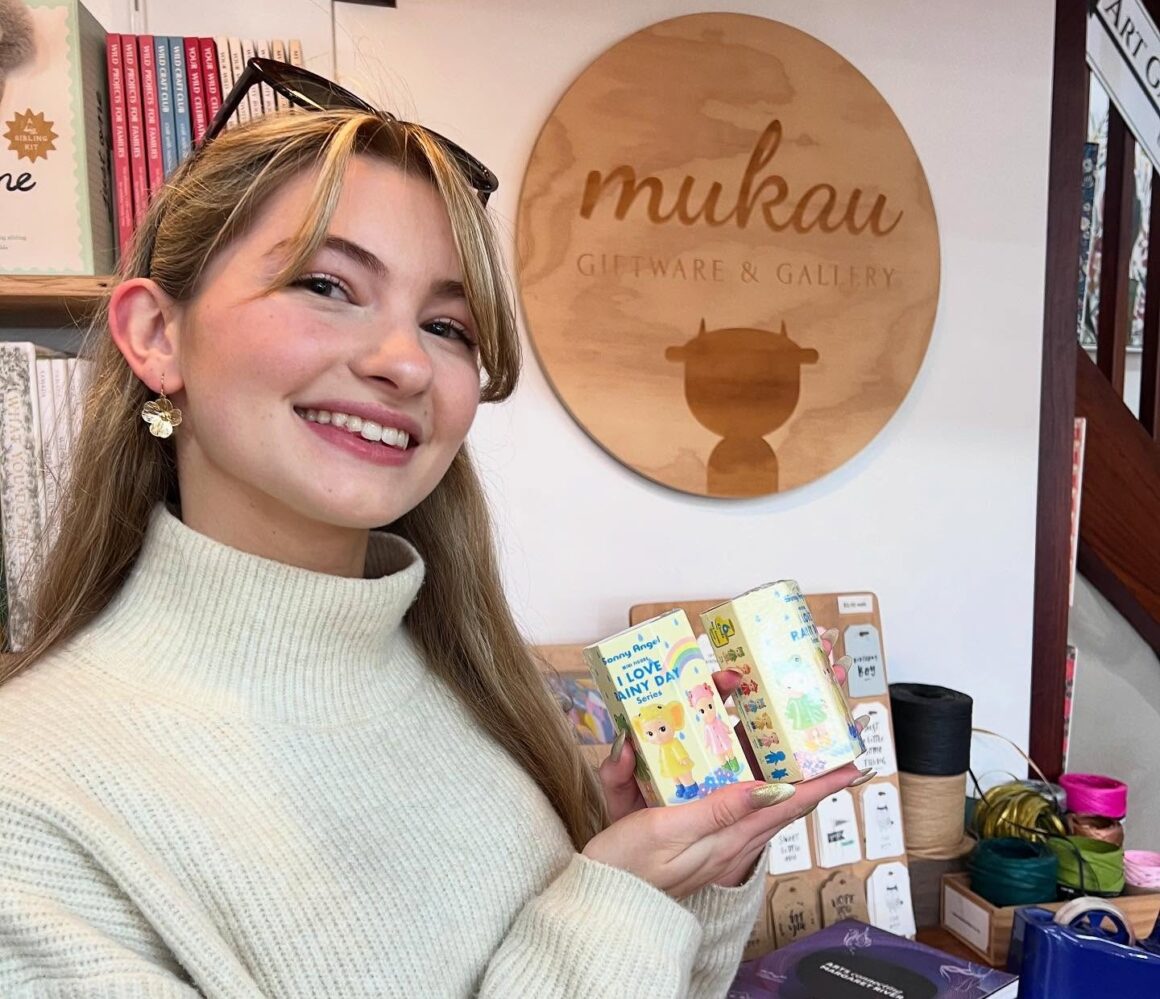 A girl holds up Sonny Angels at one of the stores that sell them in Perth