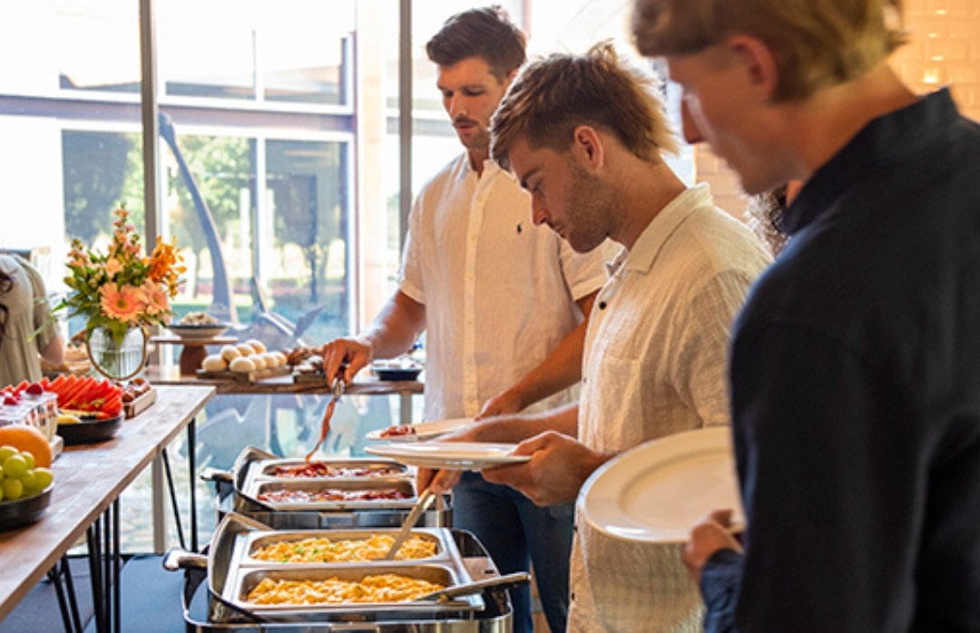 three men enjoy the buffet breakfast at homestead, pasta at alba, one of the best activities for Father's Day in Perth