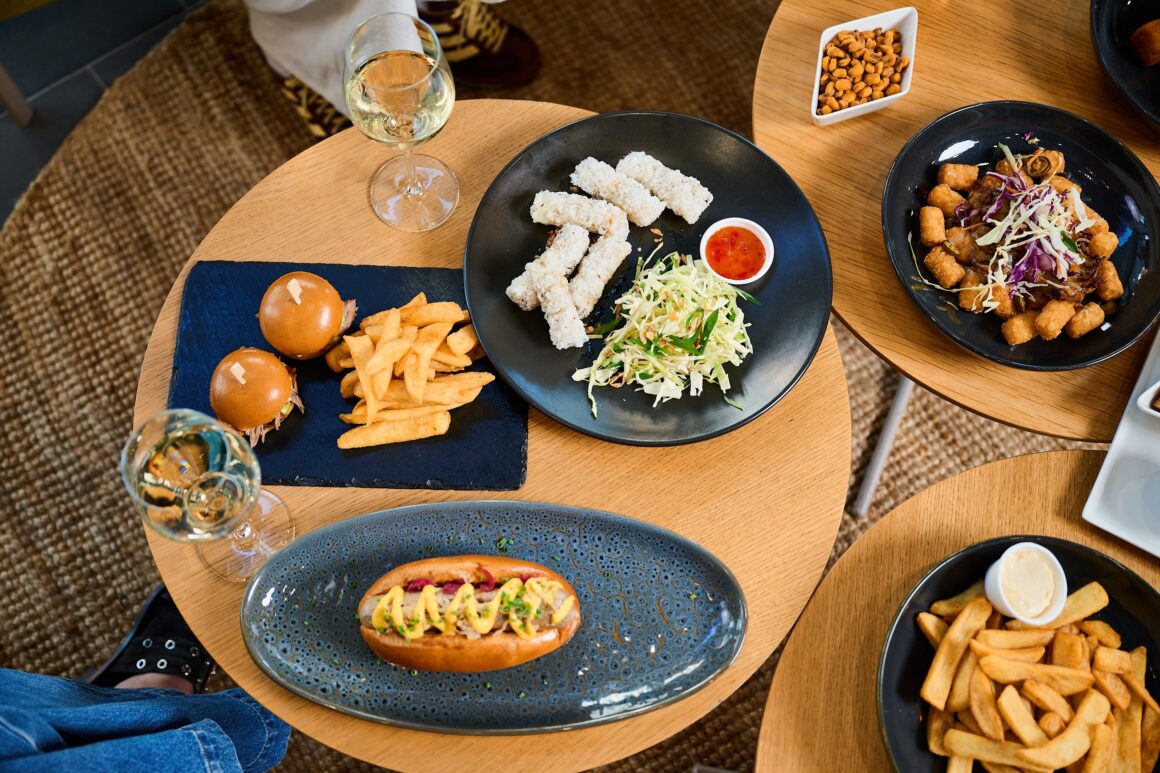 A spread of food on a table at RAC Arena showing their new menu and food options